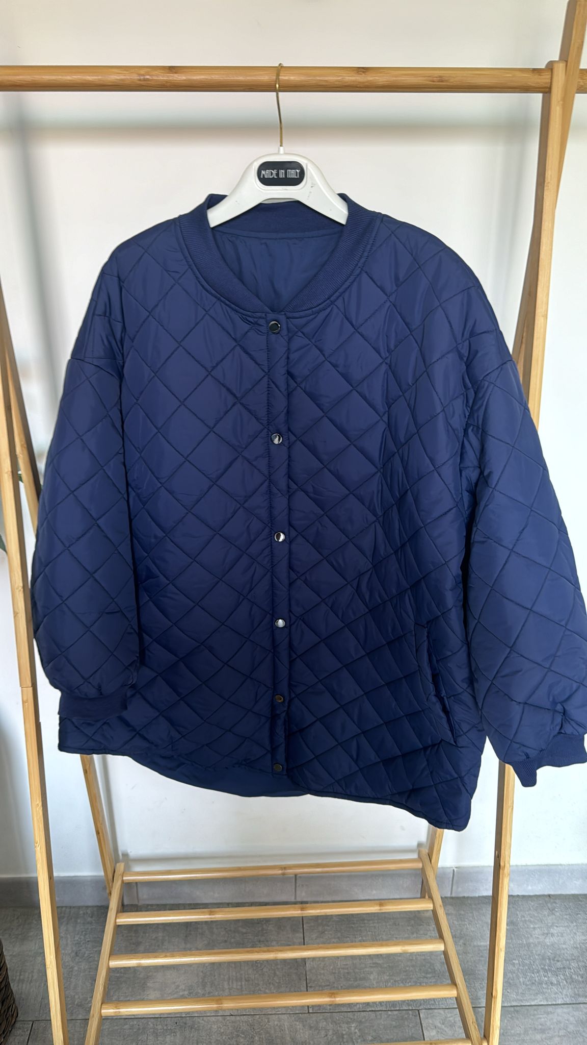 Piumino trapuntato con bottoni