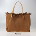 Borsa con manici in pelle e borchie
