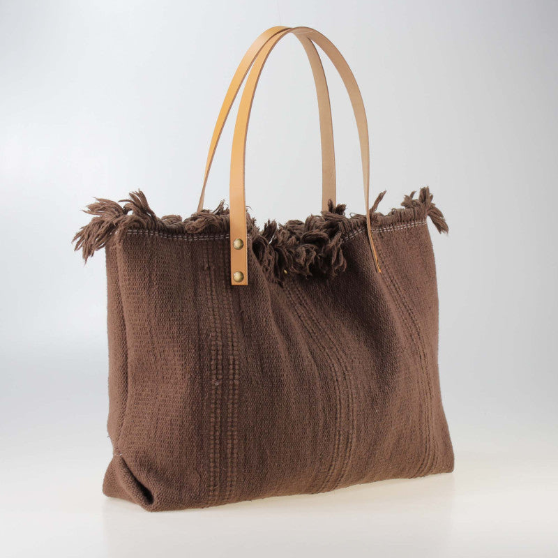 Borsa con manici in pelle e borchie